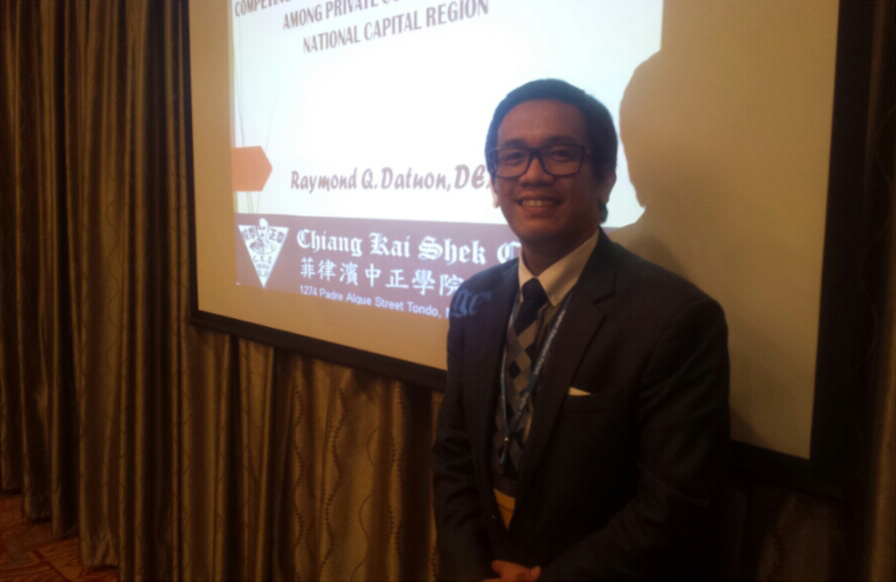 Dr. Datuon presents his paper in Beijing